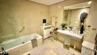 a bathroom with a tub and a sink at 2 Bedroom Apartment in Casablanca