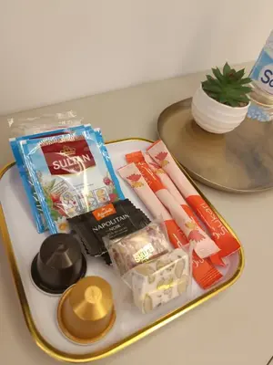 a tray with toothpaste and other items on a table at Sunny Studio Apartment with Courtyard in Casablanca