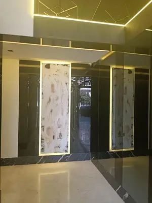 an empty room with glass doors in a building at Sunny Studio Apartment with Courtyard in Casablanca