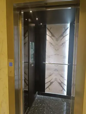 a elevator in a room with a marble wall at Sunny Studio Apartment with Courtyard in Casablanca