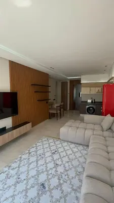 a large living room with a couch and a television at Oasis view in Casablanca