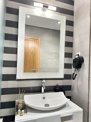 a bathroom with a white sink and a mirror at 4-Marina Calma ocean-studio coconing vue mer in Casablanca