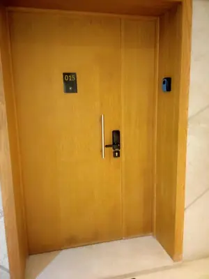 a wooden door with a sign on it at 4-Marina Calma ocean-studio coconing vue mer in Casablanca
