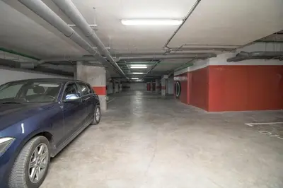 a blue car parked in a parking garage at plénitude in Mohammedia