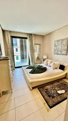 a large bedroom with a large bed and a large window at Ocean View 2 Bedroom Apartment in Casablanca