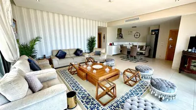 a living room with a couch and a table at Ocean View 2 Bedroom Apartment in Casablanca