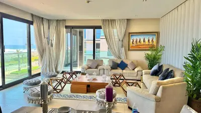 a living room with a couch and a table at Ocean View 2 Bedroom Apartment in Casablanca