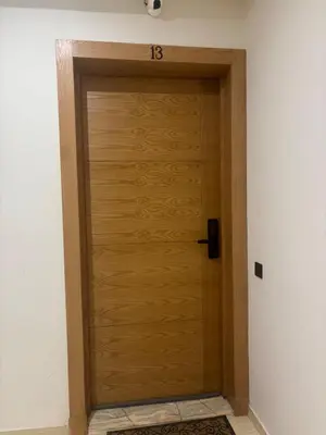 a wooden door with the number on it at Luxury apartment with sea view and 2 pools Sablettes in Mohammedia