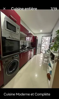 a kitchen with a stove and a dishwasher at Hébergement idéal pour conjuguer tourisme, affaires et télétravail in Mohammedia