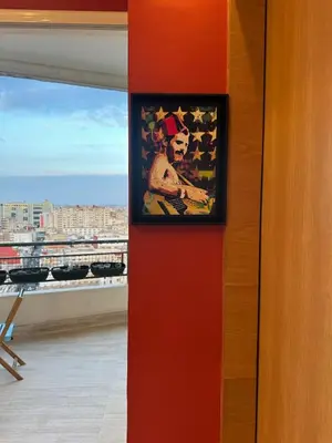 a picture of a man on a wall next to a window at Terrace & View of Casablanca Port in Casablanca