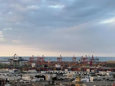 a city with a harbor with cranes in the water at Terrace & View of Casablanca Port in Casablanca