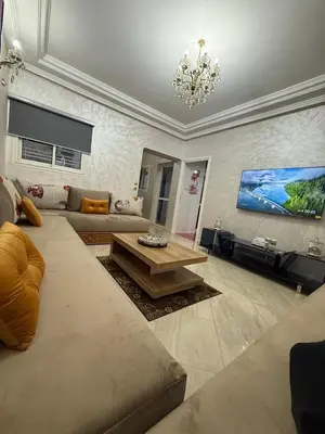 a living room with a couch and a coffee table at Pavilion à la corniche de mohammedia proche plage & centre-ville in Mohammedia