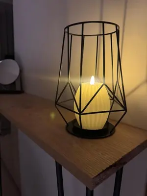 a lantern sitting on top of a wooden table at Joli Studio au Cœur de CFC En Face Aeria Mall in Casablanca