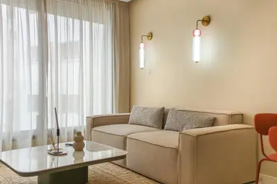 a living room with a couch and a table at Studio moderne in the Heart of Maarif Casablanca in Casablanca