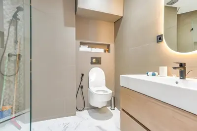 a bathroom with a toilet and a sink and a shower at Studio moderne in the Heart of Maarif Casablanca in Casablanca