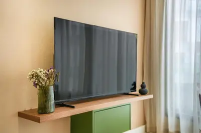 a flat screen tv sitting on top of a shelf at Studio moderne in the Heart of Maarif Casablanca in Casablanca
