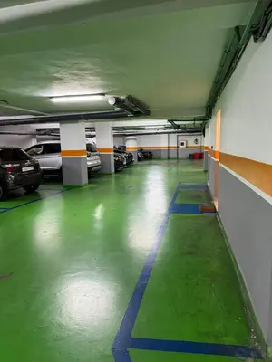 an empty parking garage with cars parked in it at Votre Cocon Moderne - Central & tout confort in Casablanca