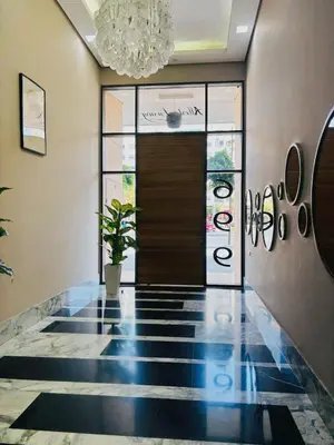 a lobby with a door and a potted plant at Votre Cocon Moderne - Central & tout confort in Casablanca