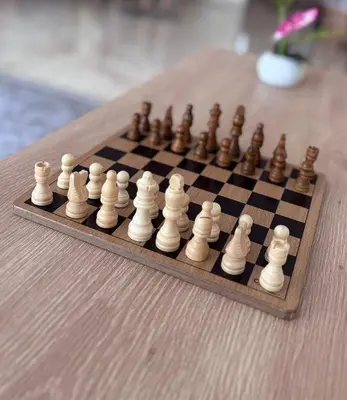 a chess board with chess pieces on a table at Shems Bouznika Residence Central & Cozy 2 Bedroom Apartment with Pool Bouznika in Bouznika