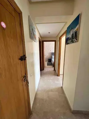 a hallway of a room with a door and a hallwayngthngthngth at Lovely rental apartment with parking in premises, in Casablanca