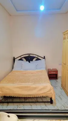 a bedroom with a bed in a room at Chez binette in Casablanca