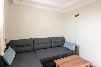 a living room with a couch and a table at Layover Guest House - Studio Rabat City Center - 4th Floor in Rabat