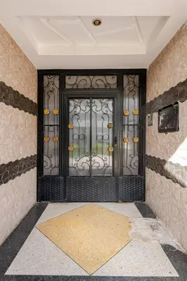 a front door of a building with a wrought iron gate at Layover Guest House - Studio Rabat City Center - 4th Floor in Rabat