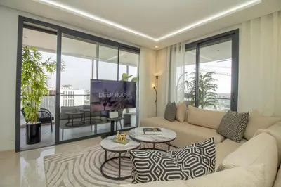 a living room with a couch and a table at Skyline Retreat in Casablanca