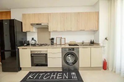a kitchen with a washing machine in the middle at Skyline Retreat in Casablanca