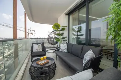 a living room with a couch and chairs on a balcony at Skyline Retreat in Casablanca