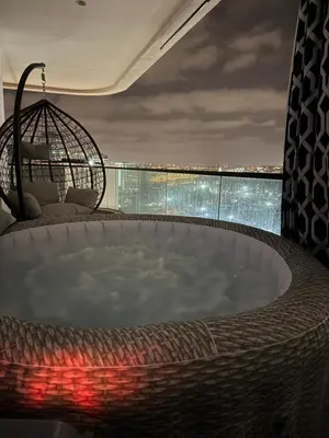 a jacuzzi tub in a room with a view at Skyline Retreat in Casablanca