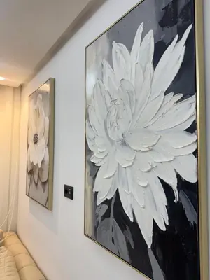 a large painting of a white flower on a wall at Skyline Retreat in Casablanca
