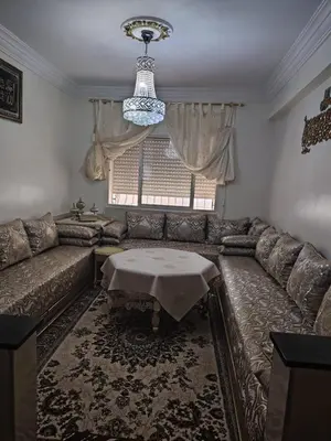 a living room with a couch and a table at Casa Hasna in Casablanca
