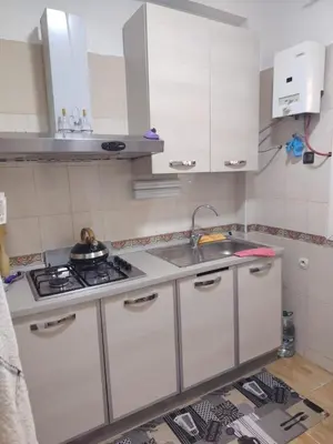 a small kitchen with a sink and a stove at Casa Hasna in Casablanca