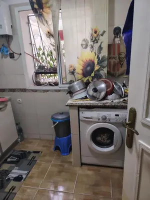 a kitchen with a washing machine and a window at Casa Hasna in Casablanca