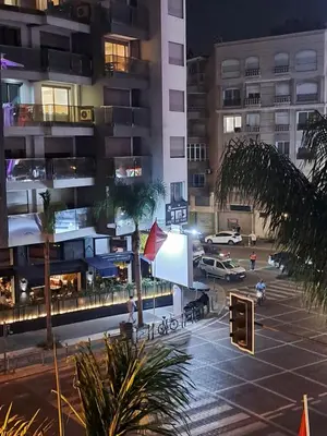 a view of a parking lot in a city at night at Holiday Appart in Casablanca