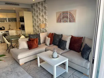 a living room with a couch and a table at Holiday Appart in Casablanca