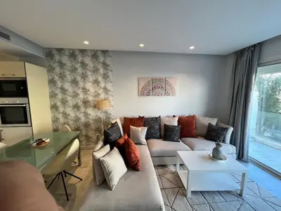 a living room with a couch and a table at Holiday Appart in Casablanca