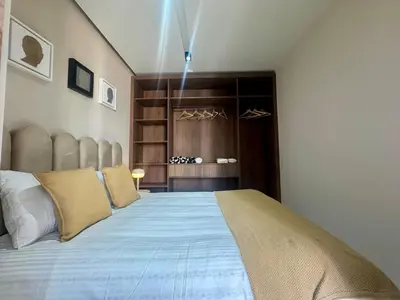 a bedroom with a large bed in a room at Scandi Design Central Casablanca in Casablanca