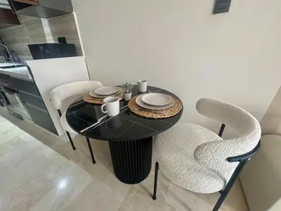 a black table and chairs in a kitchen at Scandi Design Central Casablanca in Casablanca