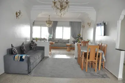 a living room with a couch and a table at Rental Apartment in Casablanca City Center in Casablanca