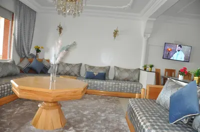 a living room with couches and a coffee table at Rental Apartment in Casablanca City Center in Casablanca