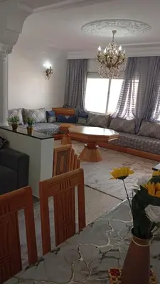 a living room with a couch and a table at Rental Apartment in Casablanca City Center in Casablanca