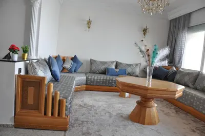a living room with a couch and a table at Rental Apartment in Casablanca City Center in Casablanca