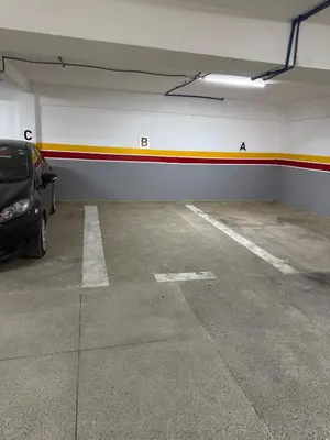 a parking garage with a car parked in it at Luxury Apartment 5min CFC in Anfa