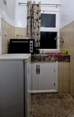 a kitchen with a microwave and a window at Nice studio for nice people in Rabat