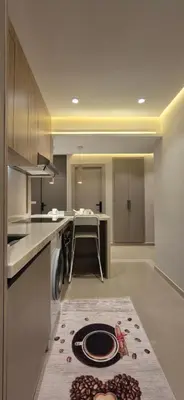 a kitchen with a sink and a table in it at Rabat Residence - OCEAN STAY 2 in Rabat