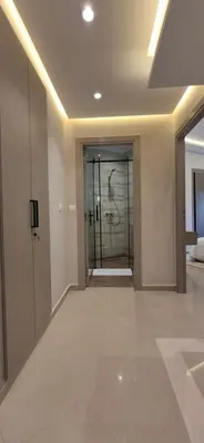 an empty hallway with a glass door in a building at Rabat Residence - OCEAN STAY 2 in Rabat