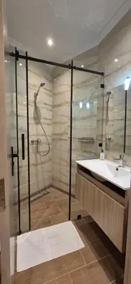 a bathroom with a sink and a shower at Rabat Residence - OCEAN STAY 2 in Rabat