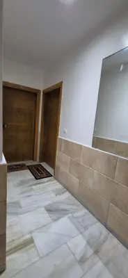 an empty room with a wall and a tile floor at Rabat Residence - OCEAN STAY 2 in Rabat